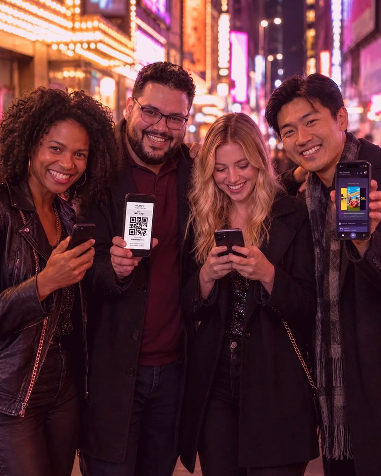 Friends holding up Broadway tickets